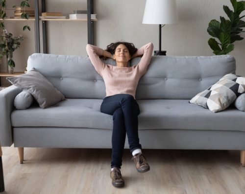 Relaxed customer in her home after Marching Maids regular maid service.